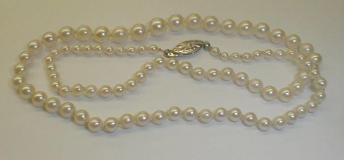 Graduated pearl necklace with 14k white gold clasp. 17.5"