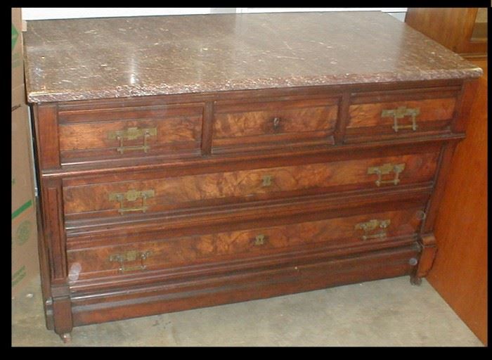 Eastlake low chest with five drawers, book matched burl walnut and beveled marble top.