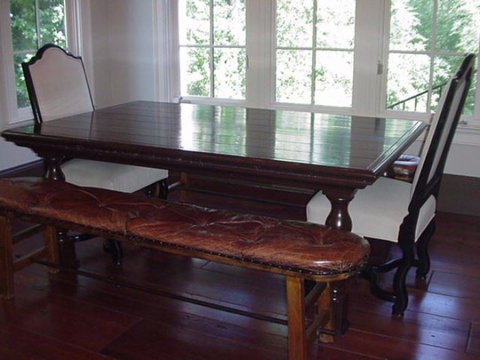 Kitchen table with two leather benches and high back chairs