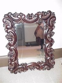 Ornately carved mirror