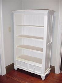 White shelf with drawers below