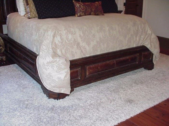 Footboard and frame of Marge Carson bed in master suite; white rug