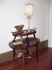 Two level oval mahogany occasional table, tray top