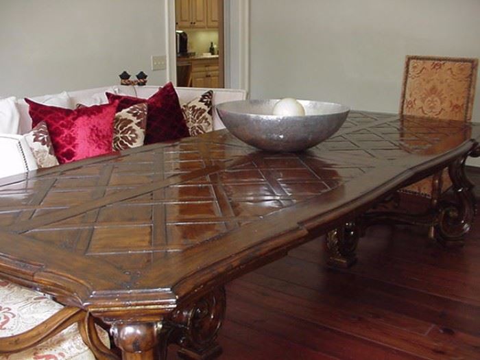 Marge Carson wood dining table, Rivoli collection, parquetry top; two additional leaves; can seat  twelve