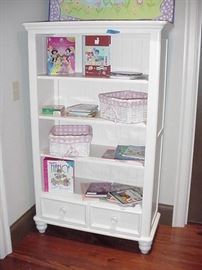 Bookcase with drawers, painted white; children's books; baskets
