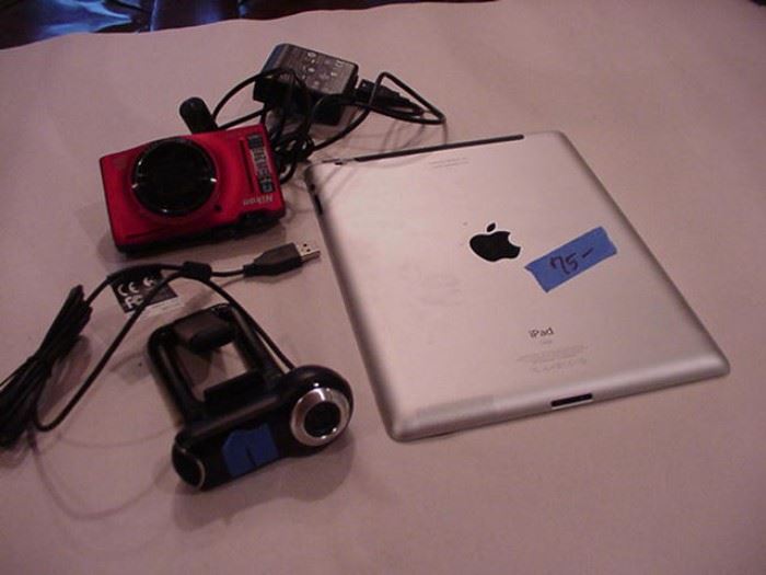Electronic gear, i pad; Cool Pix by Nikon; web cam