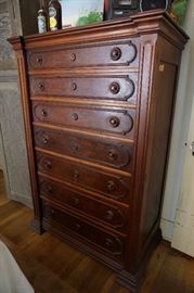 A stunning gentlemens high boy dresser.  The side pieces lock the drawers in.