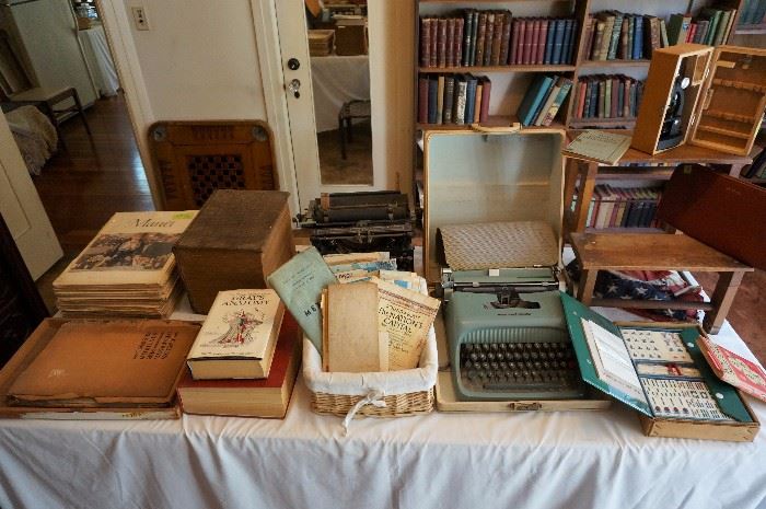 Two vintage typewriters.  Loads of paper ephemera like maps, letters, photos, hotel receipts etc ...many from the 1800s