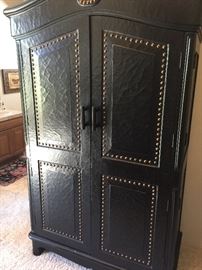 handsome armoir with nail heads & TV inside