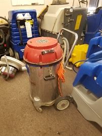 steel container upright wet/dry vacuum.On rollers and of commercial value but priced to sell. 