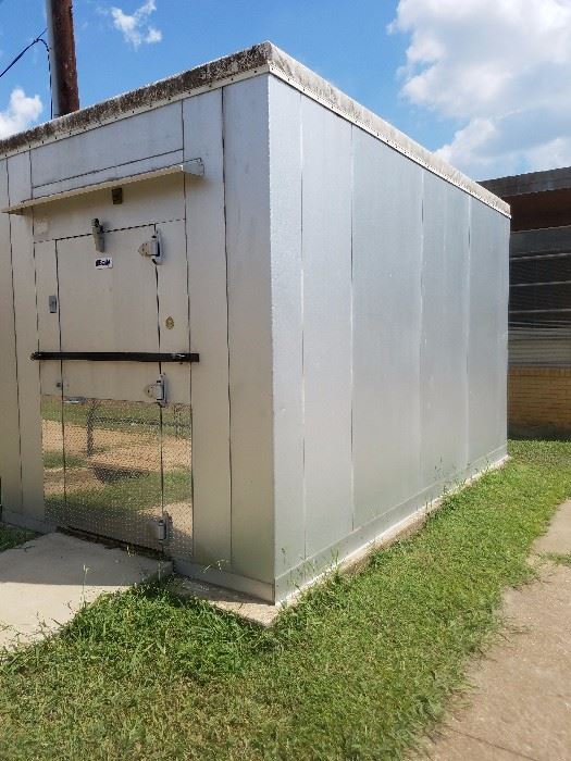 outside view of freezer installed on slab and almost ready for decommissioning.  This freezer was and is currently still used by the ISD Cafeteria daily.