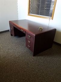 dark mahogany desk with matching accessories.