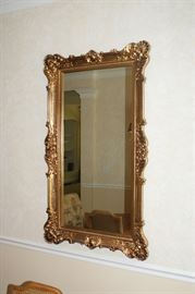 Gold tone framed wall mirror
