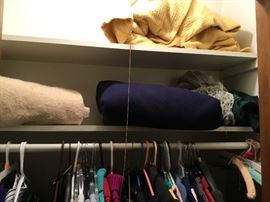 Blankets & clothing in hall closet