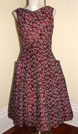 Vintage late 1940s cold pressed for and flare dress with hip pockets.  Side metal zipper.