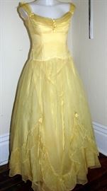 Lovely 1940s party dress with ruffled flounce, gathered neckline, and adorned with small flowers. 