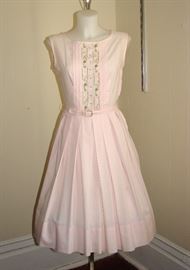 Soft pink 1950s fit and flare pink dress with original belt.