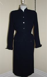 Bonnie Cashin 1950s 2-piece crepe suit in black.  Long skirt and peplum waist jacket.