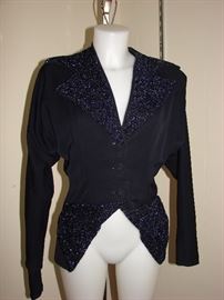 Amazing 1950s jacket with extensive beading on lapels and pockets.