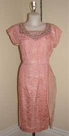 1940s all over lace party dress with exquisite hand beading around neckline.  Built in side sash.