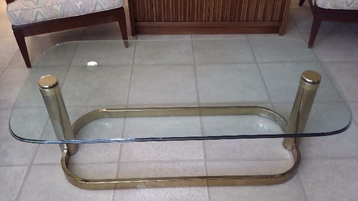 Glass coffee table with brass base