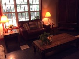 LEATHER LOVESEAT AND RUSTIC COFFEE TABLE  
