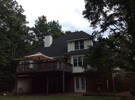 BACK SIDE OF THE 3 LEVEL HOUSE WITH FINISHED BASEMENT/SEPARATE WORK AREA FOR STORAGE AND TOOLS, ETC