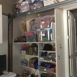 Massive amount of boys toys including legos, magic Castle, microscopes, teescopes, hundreds of childrens books, dress up, American girl Dolls - this is just one small corner of a massive 2 car garage filled to the rim with both boy and girl contemporary toys and books.