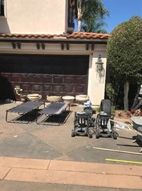 2 camp beds, tons of cement and faux cement planters and flower arrangements,