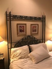 Metal Queen size bed and loads of decorative pictures