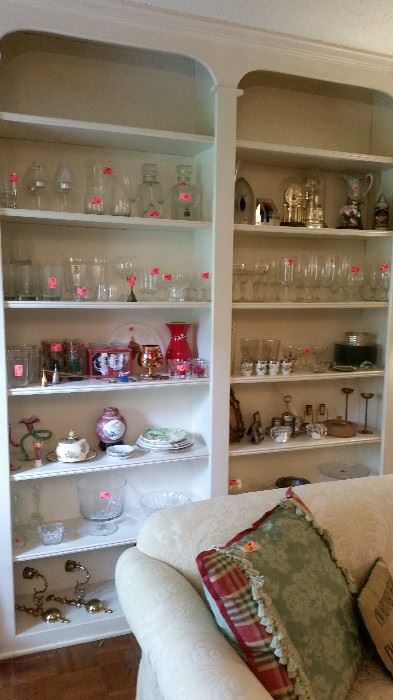 Example of bookshelves loaded with glassware, crystal, porcelain, etc.