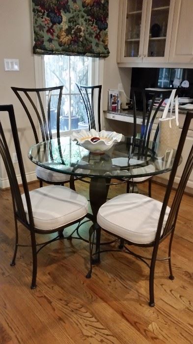 Contemporary iron and beveled glass breakfast group.