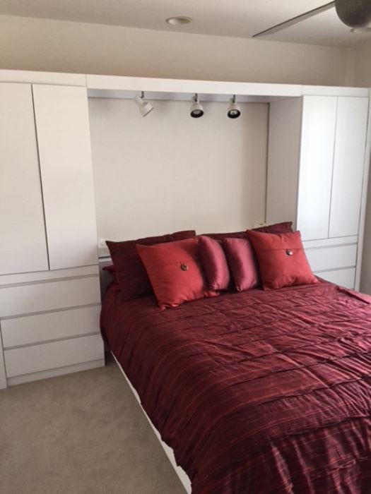 CUSTOM made by Design Studios of Skokie. Framed queen size bed with cabinets at both heads of bed. Quality white finish, can lighting between cabinets. Coverings and decorative pillows, long white dresser in another picture. ASKING $1000 for set