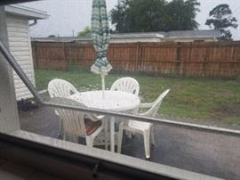 Set being sold together. Wrought iron umbrella stand also. Additionally, there are two sets of two chairs with side tables. 
