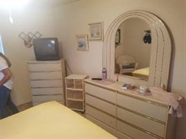 Bedroom set. There are also two night stands and a headboard. 