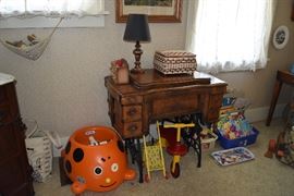 sewing machine ( cabinet only) & assorted toys