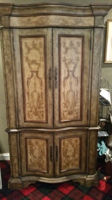 Decorative armoire, shelving in bottom (no drawers).  Top has one shelf, missing rod for clothes.  Was used in office.