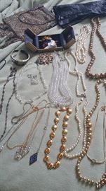 antique to new jewelry.  3 sets of real pearls with diamond accents, gold dipped flower pin.  Austrian crystal necklaces (2).  Antique handbag & vintage black gloves with lace