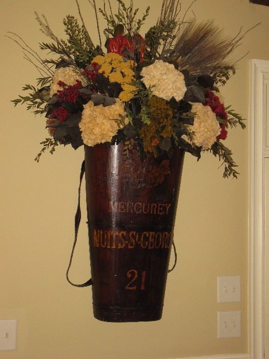 Antique French grape harvesting basket with floral arrangement