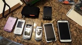 Several cell phones, including a Samsung Galaxy 5