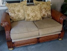 Elegant outdoor/indoor love seat with wicker accents. REMOVED!