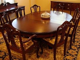 Terrific and rare 60 in wide pedestal mahogany table and 8 matching chairs-all completely restored. It goes from round to 9ft long with 4 matching leaves!