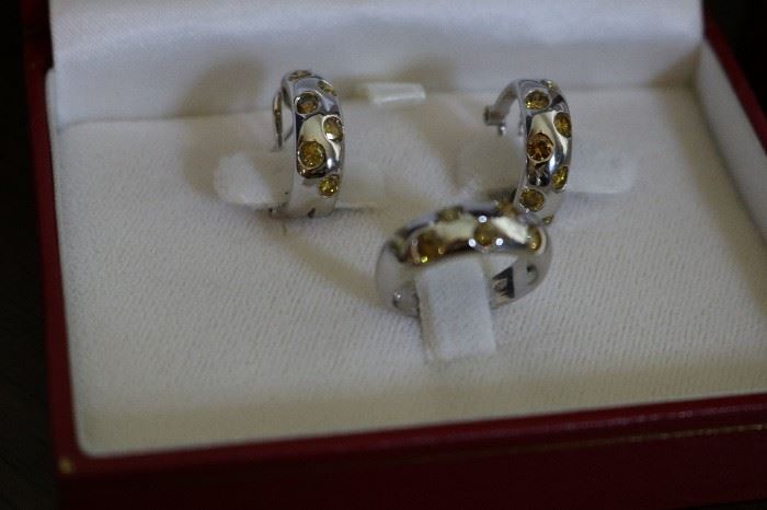 Ring and earrings are white gold and yellow diamonds. Has been appraised by a certified gemologist.