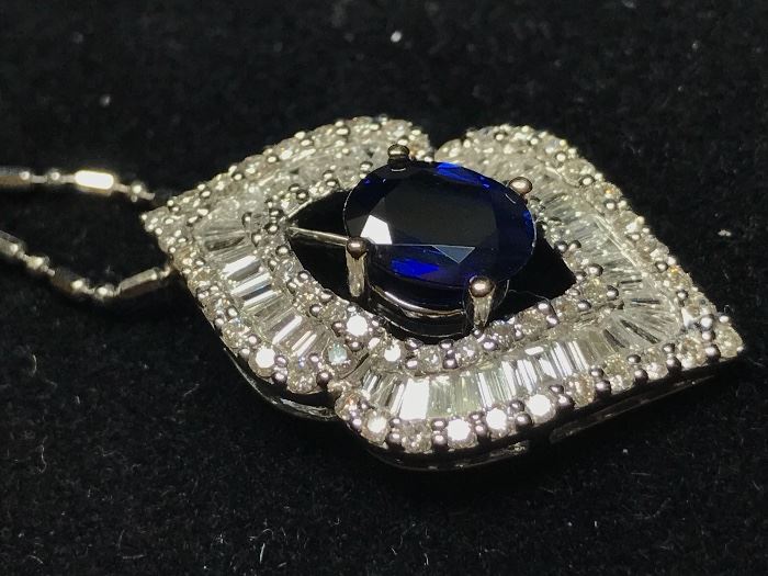 Blue Sapphire pendant is in 18k gold. The Sapphire is 1.43 and the diamonds are 2 ctw. The chain is 14k and is 16". This has been appraised by a certified gemologist and the appraisal will be available to the purchaser.  