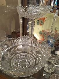 Cut lead crystal. Excellent condition. Includes compote, bowls & misc small pieces. Pinwheel & flower patterns. 