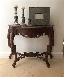 The table and tall candleholders are sold.