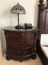 Chest of drawers and Tiffany-style lamp are sold.