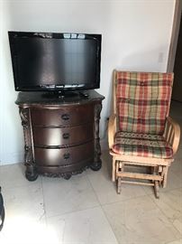 Chest of drawers and glider are sold.