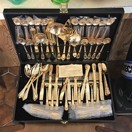 Gold plated flatware set (never used)