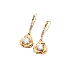 14K Yellow Gold Cubic Zirconia Dangle Earrings: A pair of 14K yellow gold cubic zirconia dangle earrings. This pair of earrings features a prong set round brilliant cut cubic zirconia, which is surrounded by a triangular swirl design. The earring design dangles directly from the earwire.